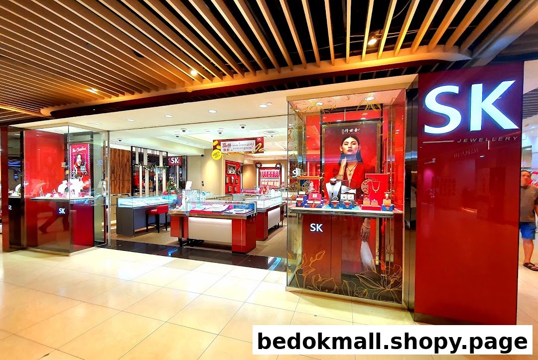 Front view of a jewelry shop with display cases and red accents.