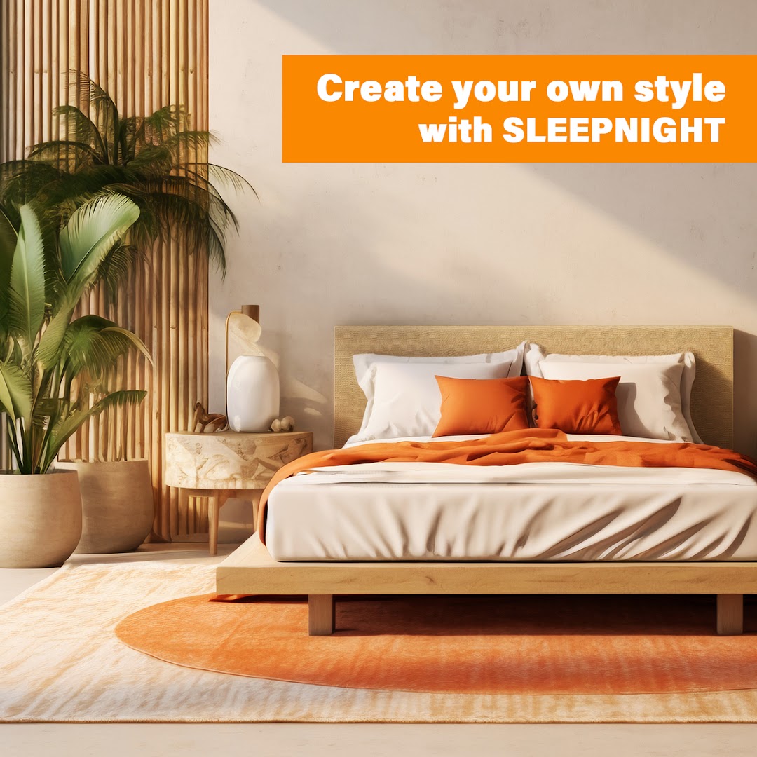 A modern bedroom setup with a bed, orange bedding, and a SLEEPNIGHT banner.