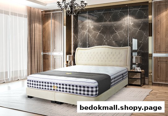 A bed with a mattress and headboard in a bedroom setting.