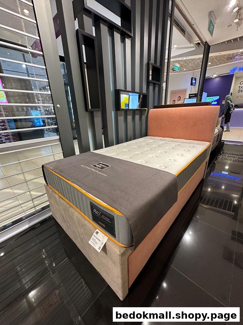 Mattress and bed frame on display in a retail shop.