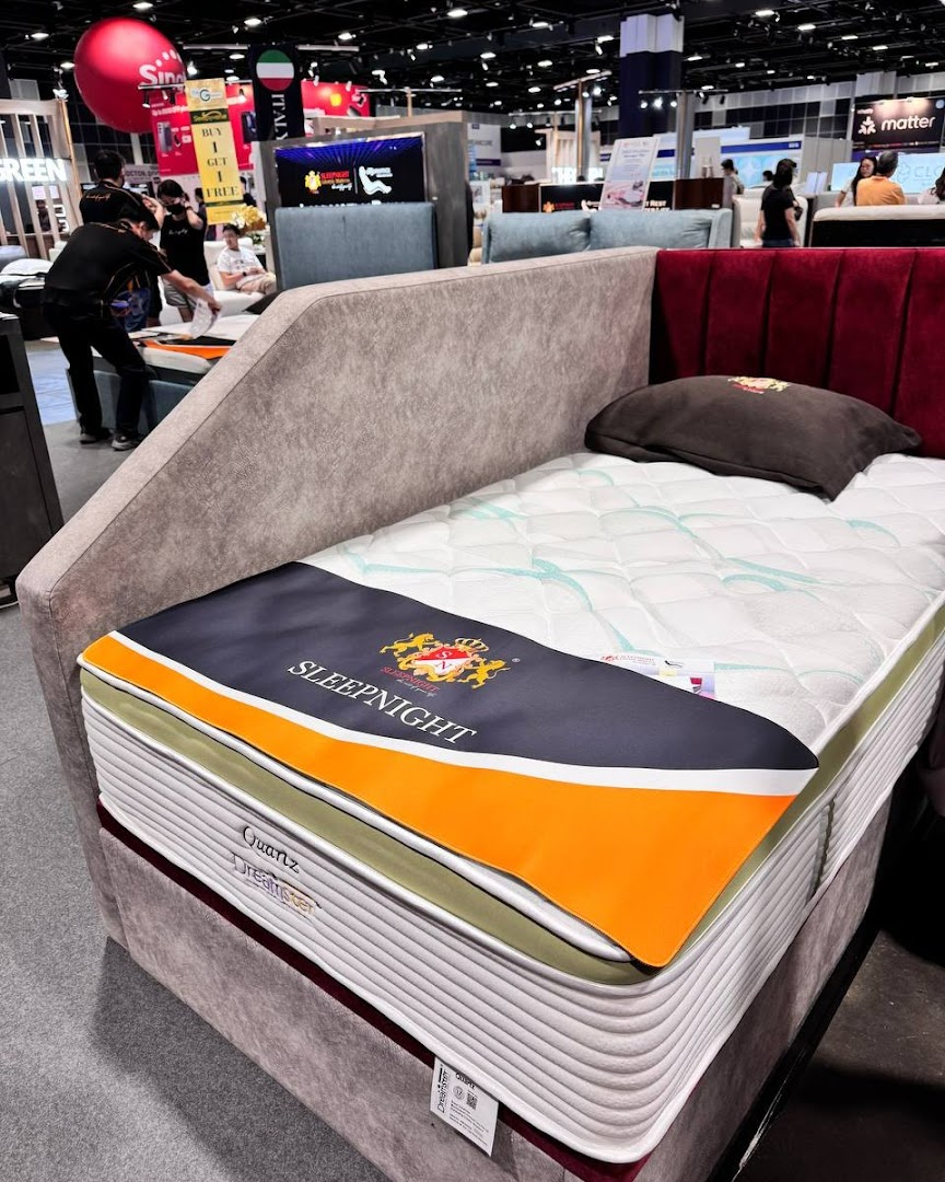 Interior shot of a SLEEPNIGHT mattress on display with a bed frame.