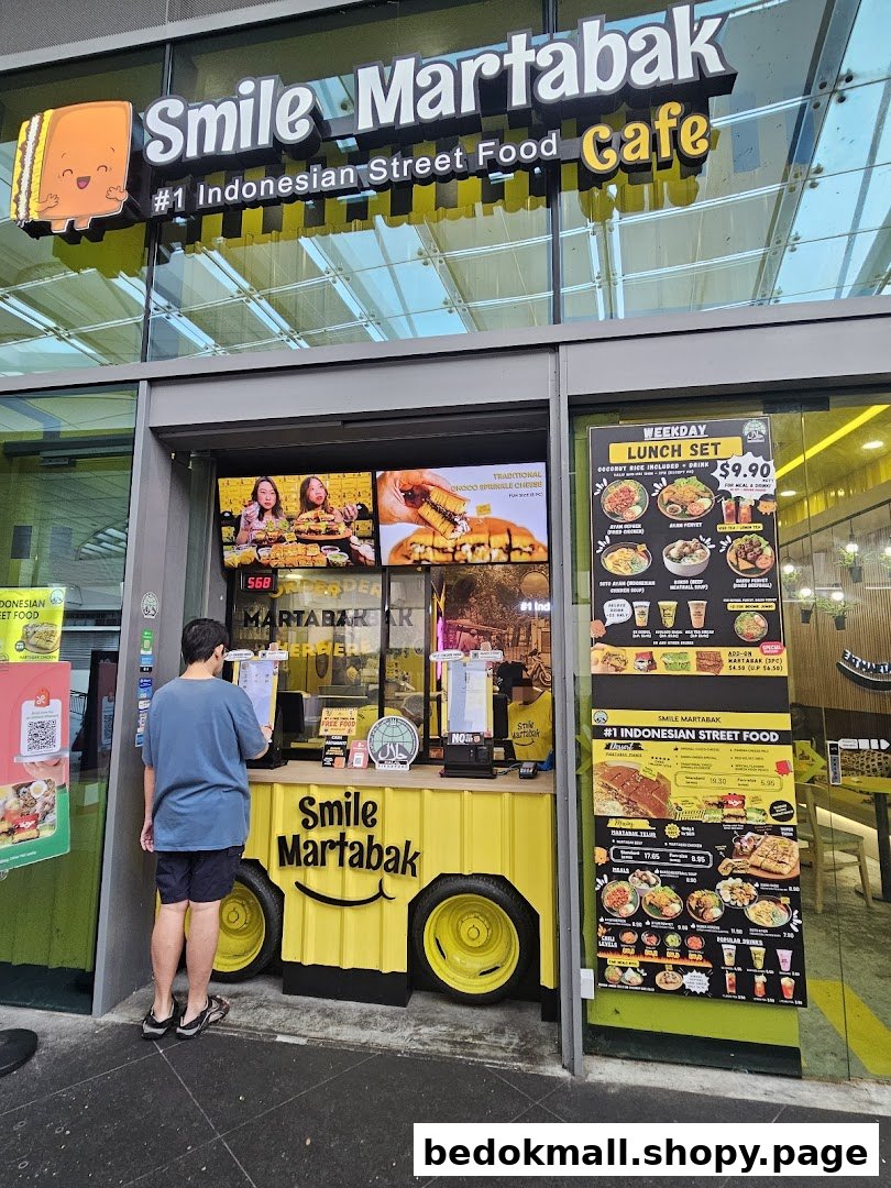 Exterior view of Smile Martabak Café with a customer at the ordering counter.