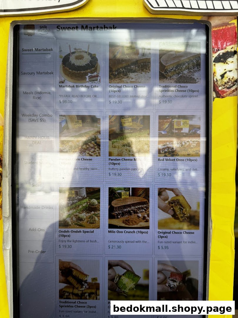 A digital menu display showing various martabak products with prices and images.