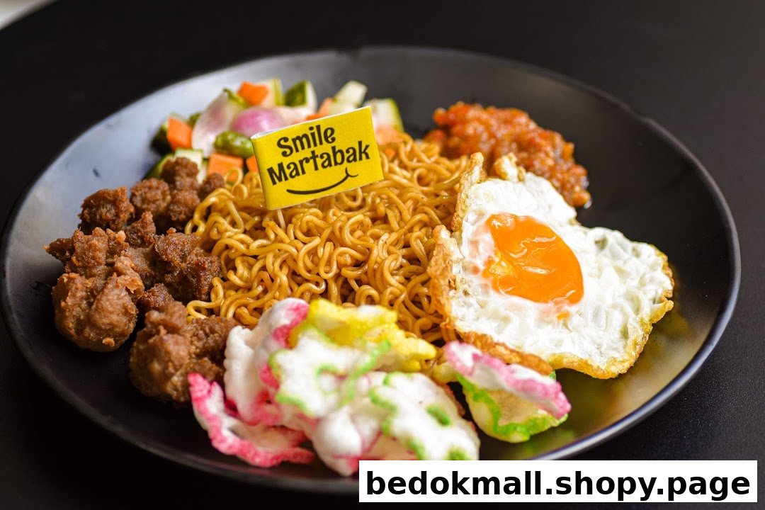 A plate of noodles with fried egg, meat, vegetables, and crackers.