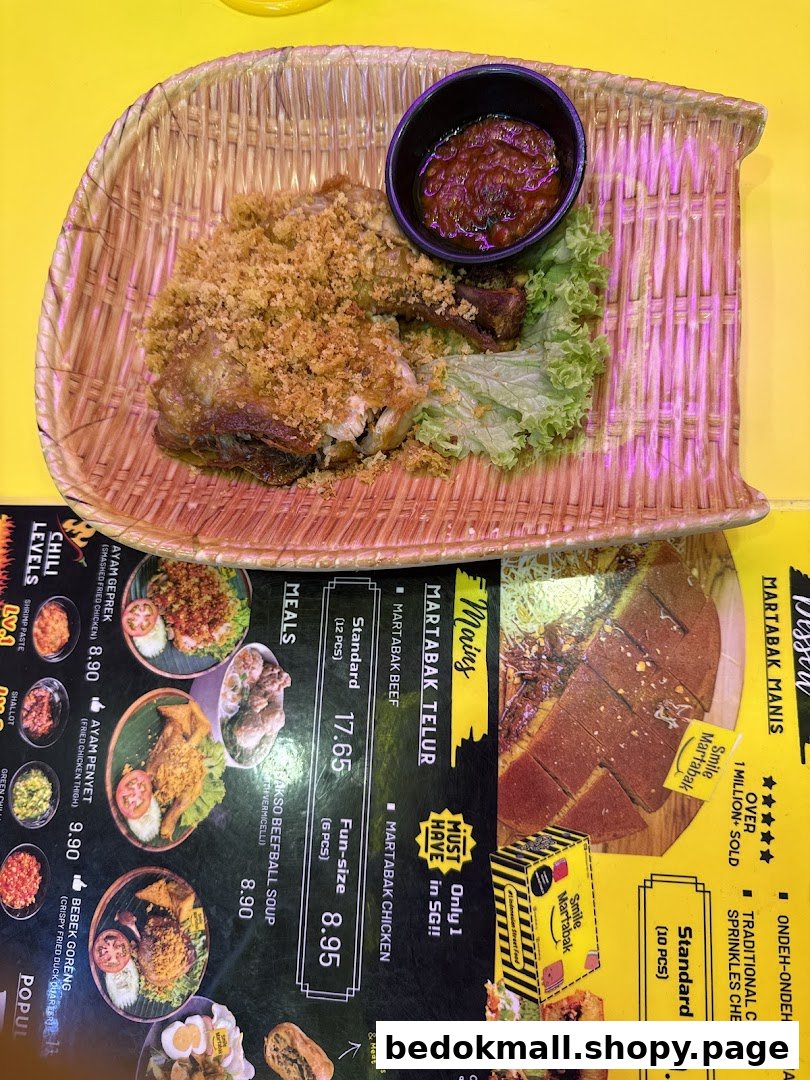 Fried chicken dish on a table next to a detailed food menu.