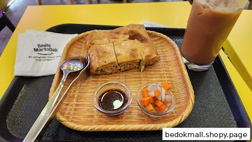 Martabak, drink, and condiments served on a tray.