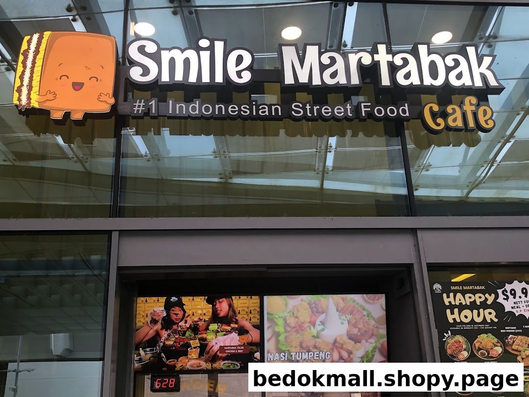 Shop entrance featuring 'Smile Martabak' sign and promotional screens.