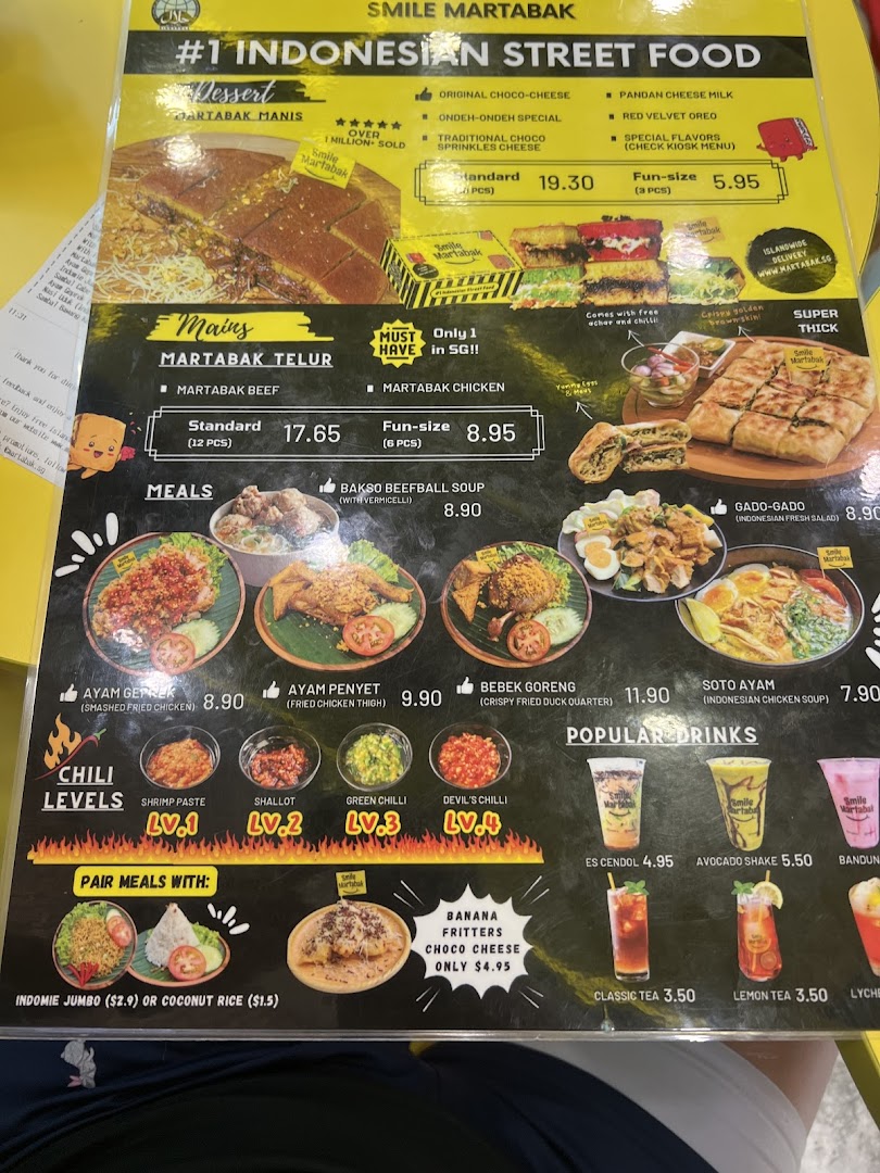 A detailed menu board displaying Indonesian street food, desserts, meals, and drinks.