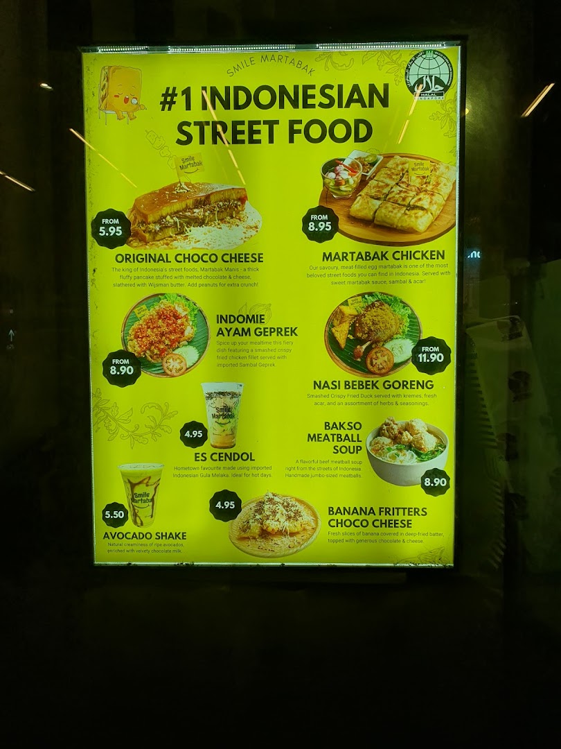 A brightly lit menu board displaying Indonesian street food, drinks, and prices.