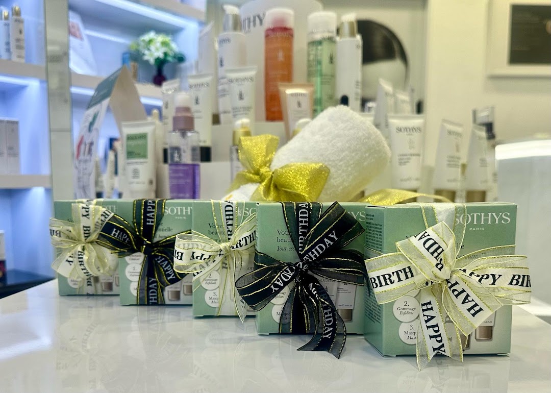 Gift-wrapped Sothys skincare products on display inside a salon.