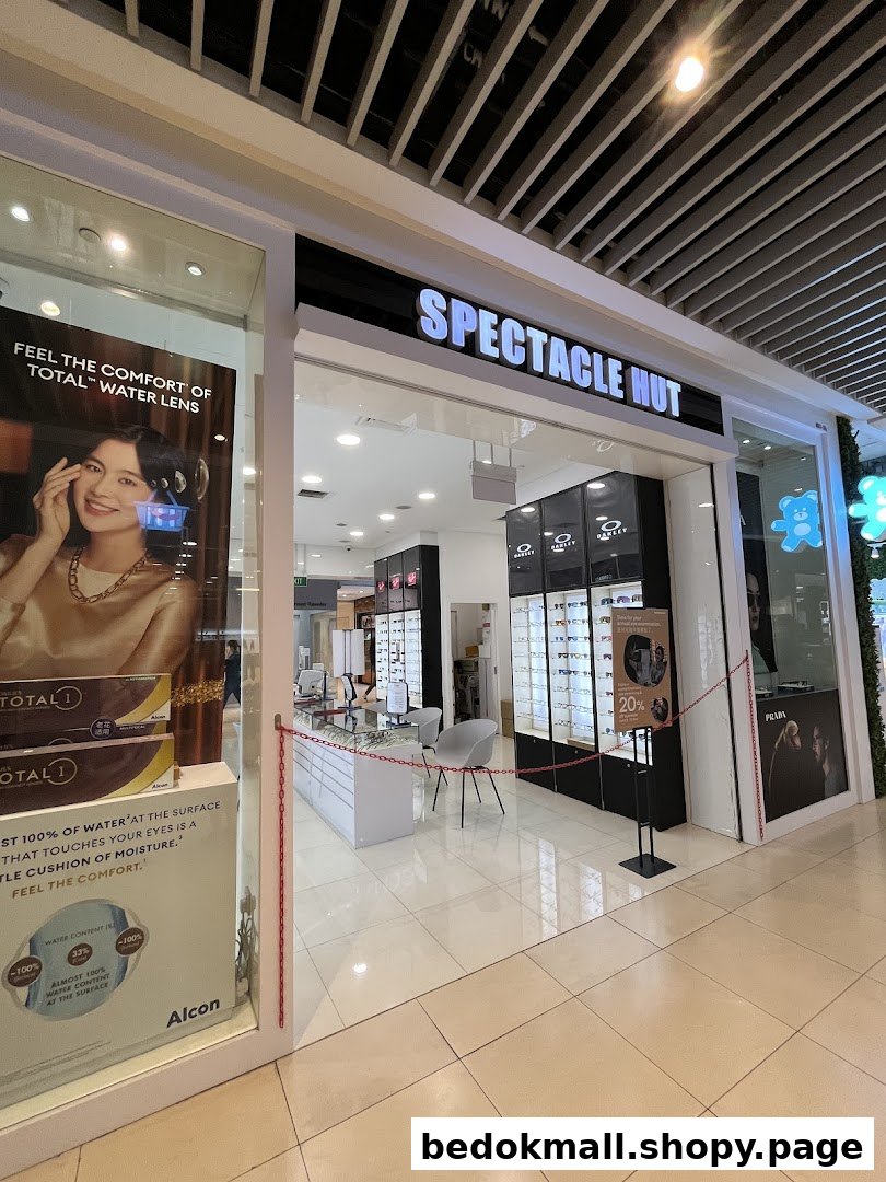 Entrance of Spectacle Hut optical shop with display windows and interior view.