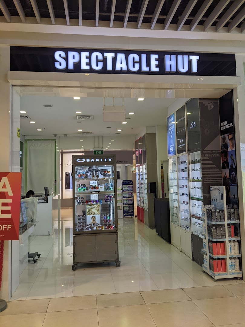Entrance of Spectacle Hut optical shop with displays visible inside.