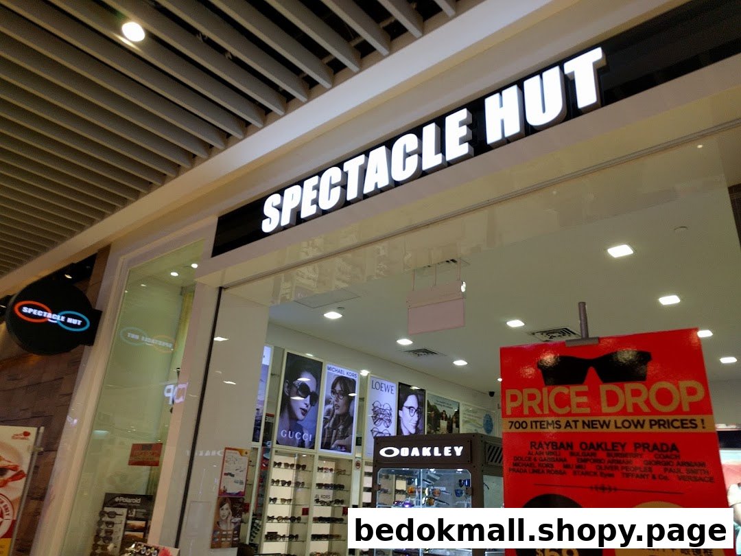 Entrance of Spectacle Hut with its main sign and a promotional banner.