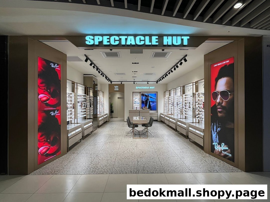 Entrance of an eyewear shop with displays and promotional posters.