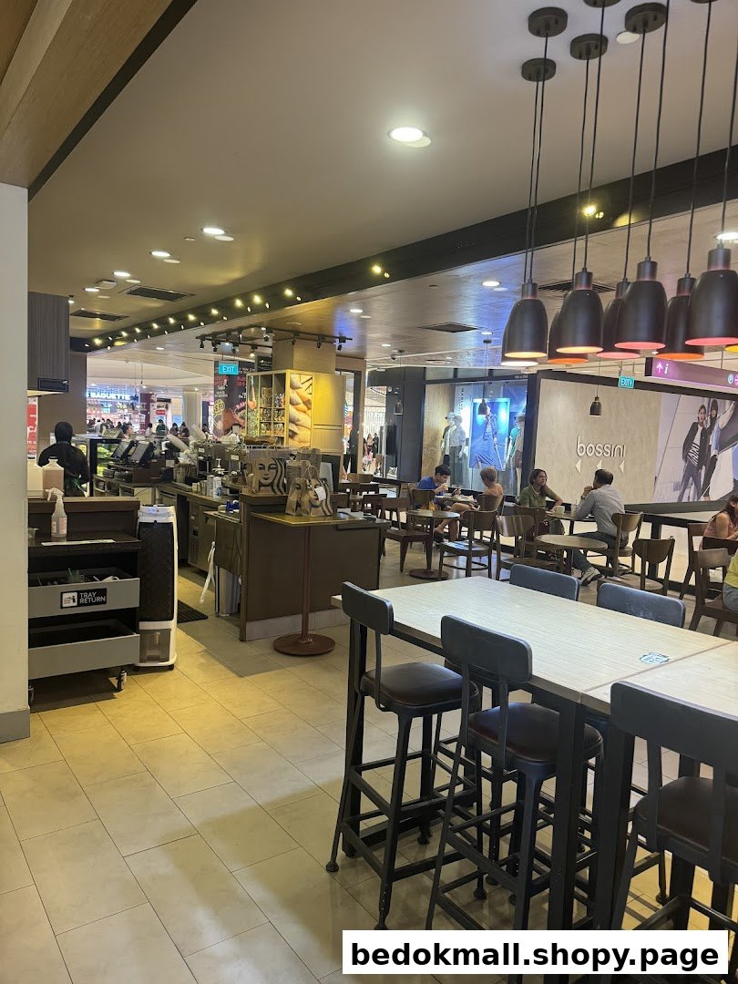 Starbucks interior with counter, seating area, and customers.