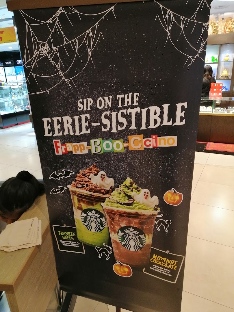 Starbucks Halloween banner advertising Frapp-Boo-Ccino drinks with images and descriptions.