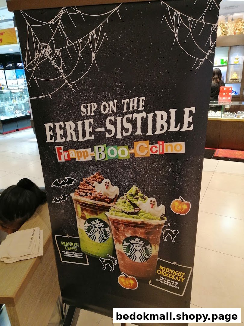 Starbucks Halloween banner advertising Frapp-Boo-Ccino drinks with images and descriptions.