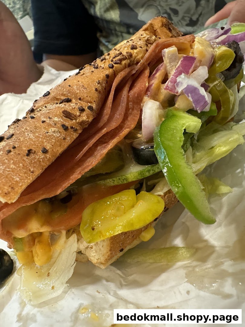Close-up of a Subway sandwich with various toppings and ingredients.