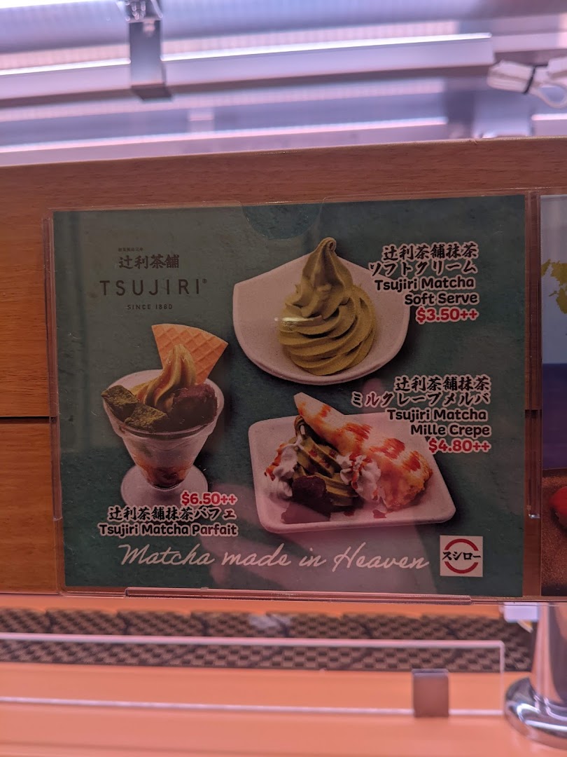 A menu board displaying various matcha desserts with prices.