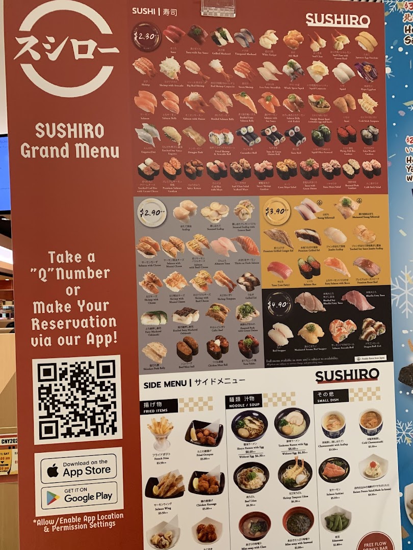 A large menu board displaying various sushi and side dishes with prices.