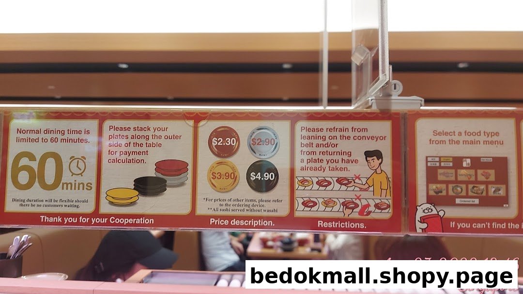 Instructional signs and plate pricing visible in a restaurant setting.