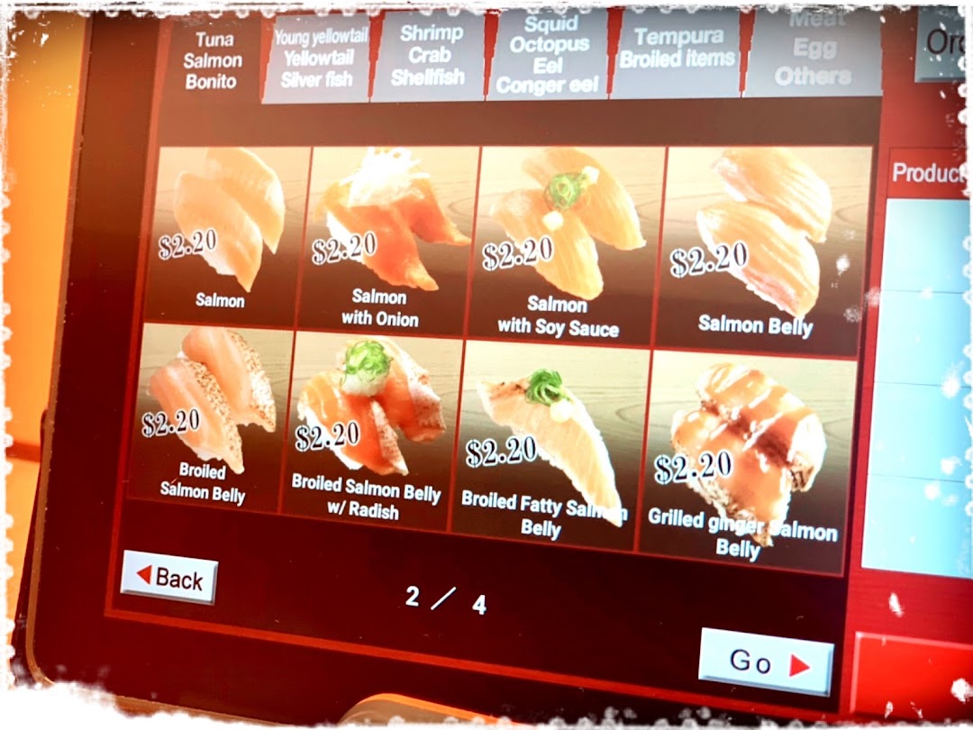 Close-up of a digital menu screen featuring various salmon sushi items.