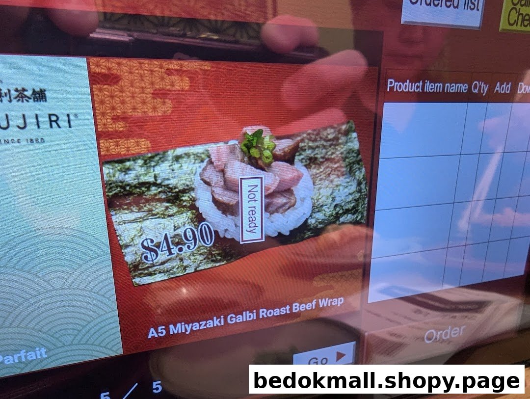 A digital menu screen showing a roast beef wrap item and price.