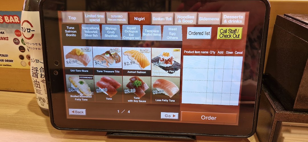 A tablet displaying a digital menu for sushi with prices and ordering options.