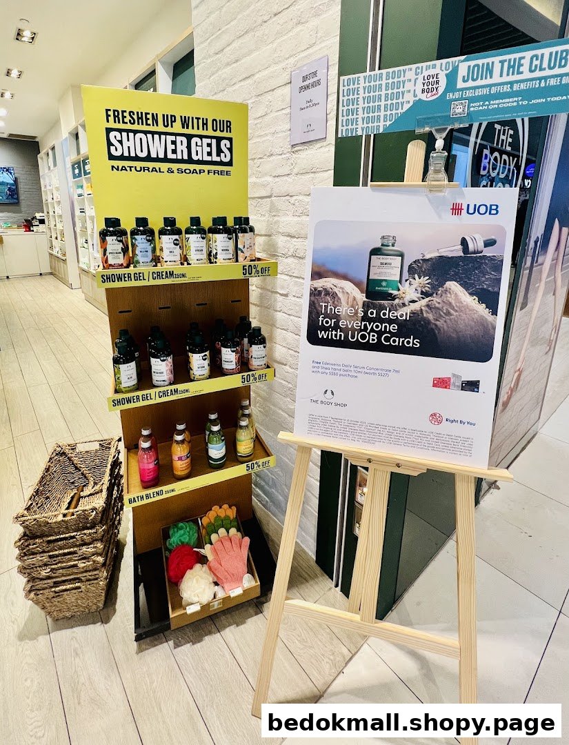 Shop interior showing a shower gel display and a promotional sign.