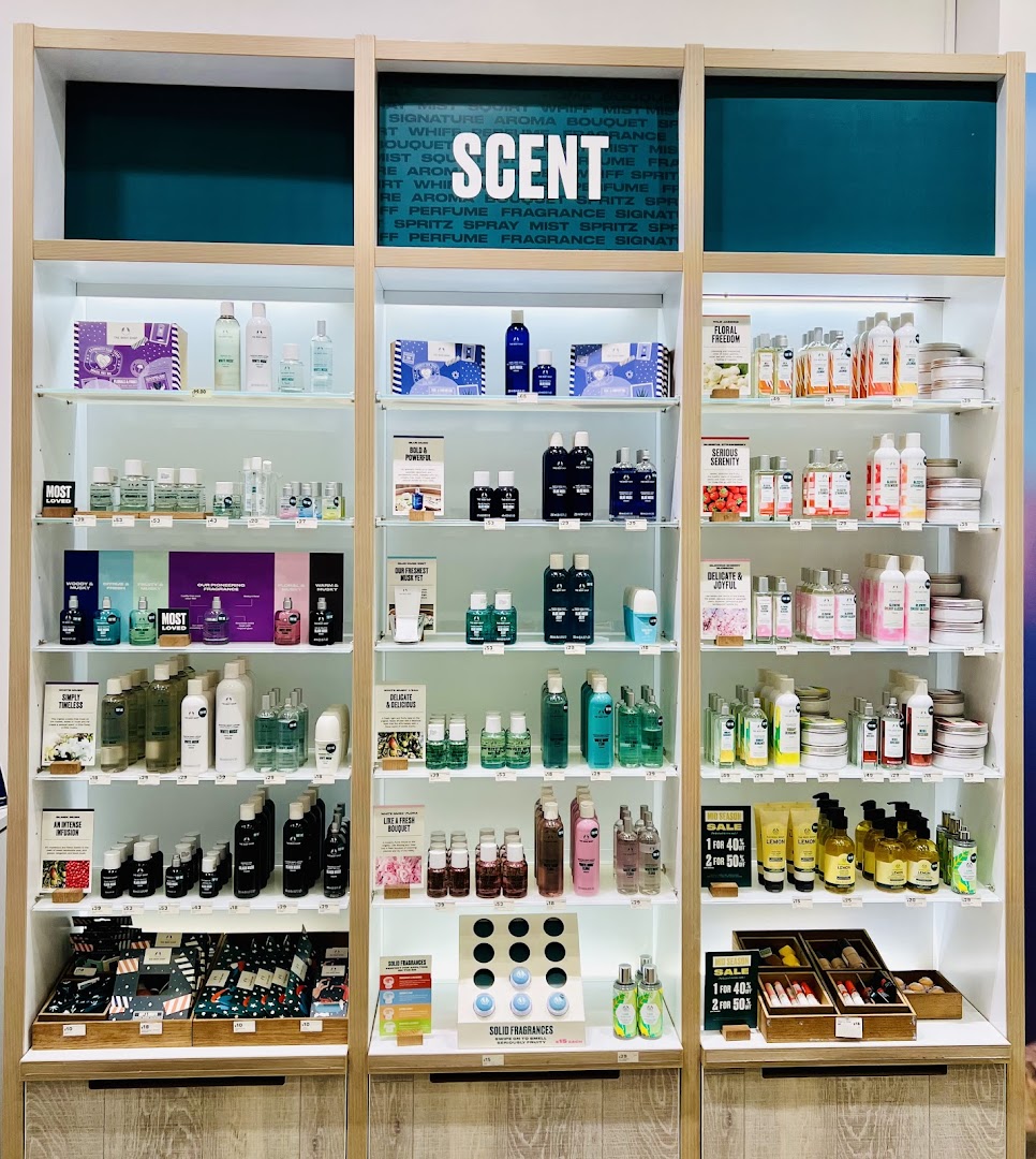 Interior shot of a retail display shelf with various beauty products.