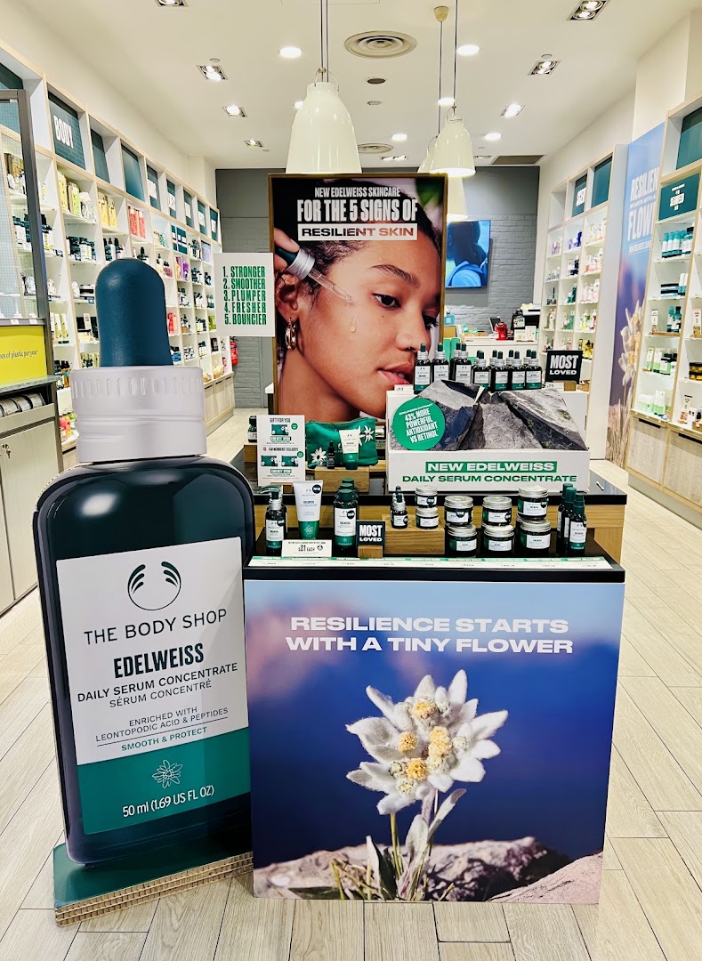 Interior shop display featuring Edelweiss skincare products and promotional signage.