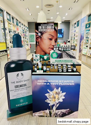 Interior shop display featuring The Body Shop Edelweiss serum and promotional materials.