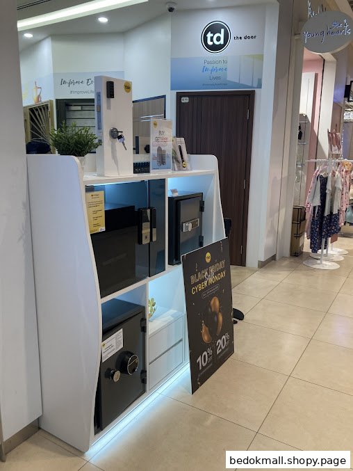 Interior view of a shop displaying security products like safes and locks.