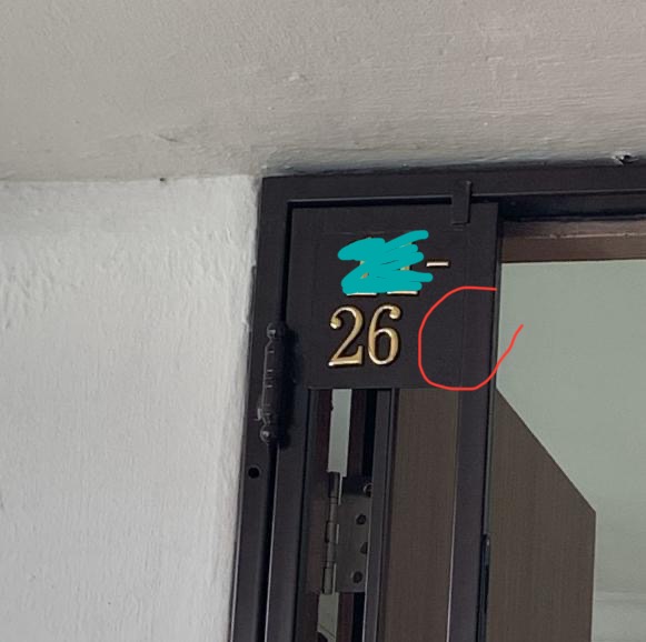 Entrance door with number 26 on a black plate.