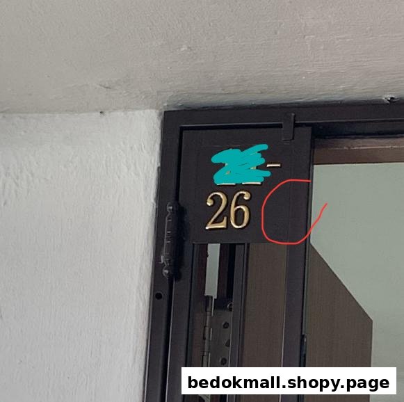 Entrance door with number 26 on a black plate.