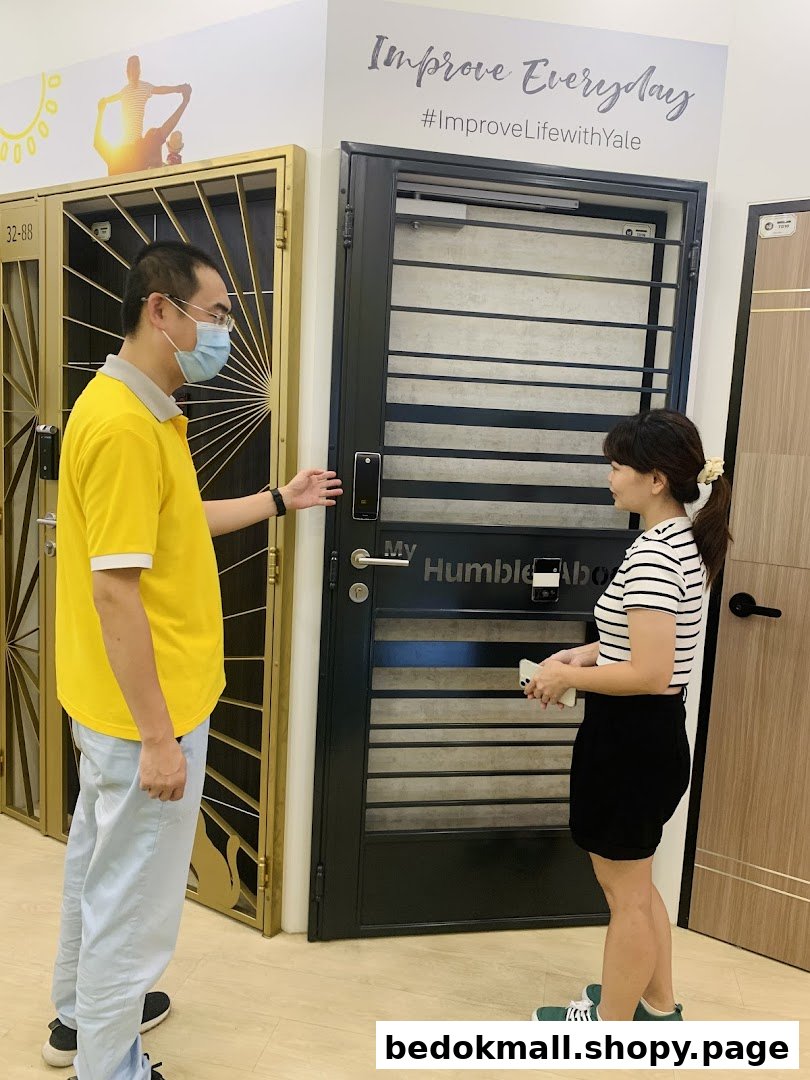Two people in a door showroom, looking at displayed doors.