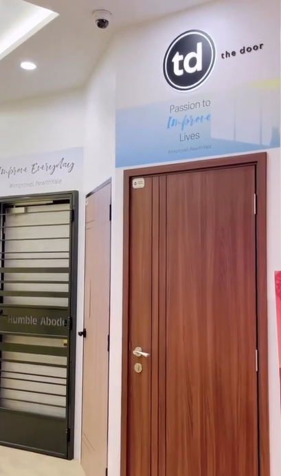Interior view of a shop displaying various doors and security gates.