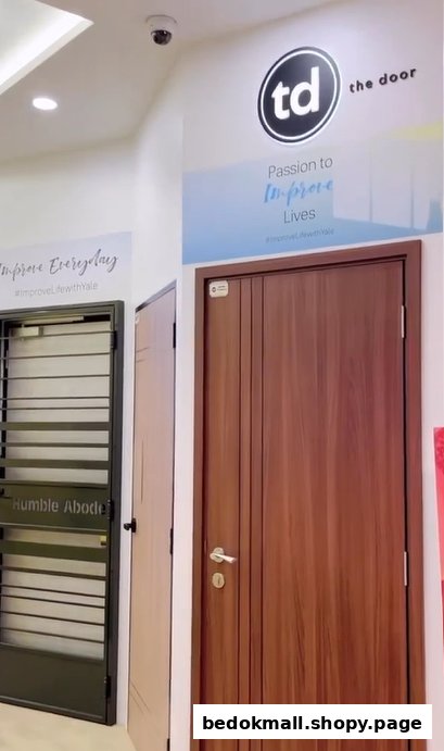 Interior view of a shop displaying various doors and security gates.