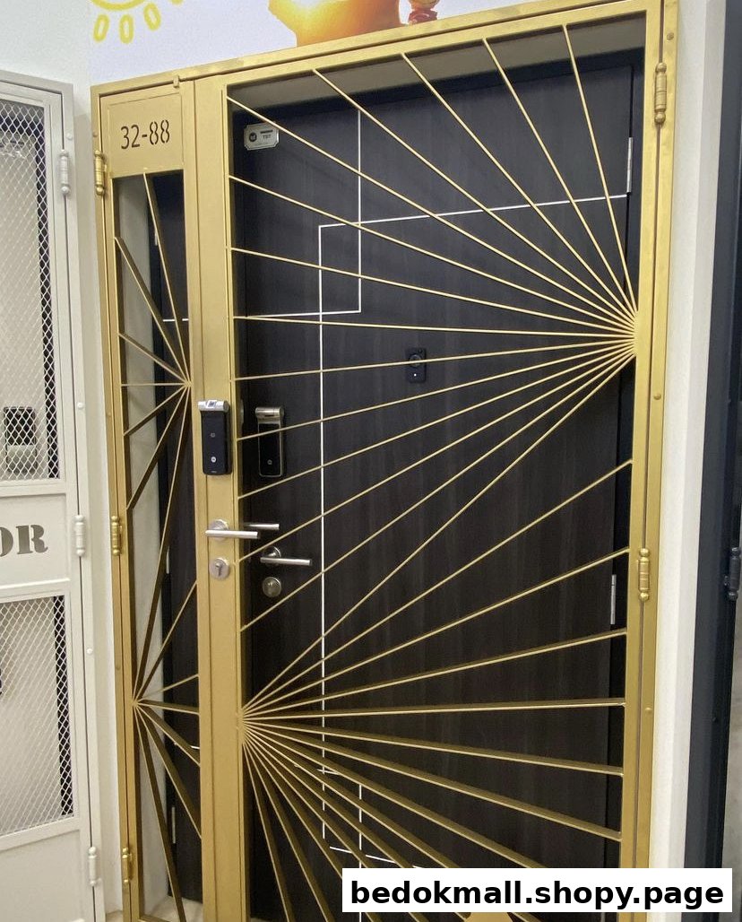 A golden security gate with a sunburst design in front of a dark door.