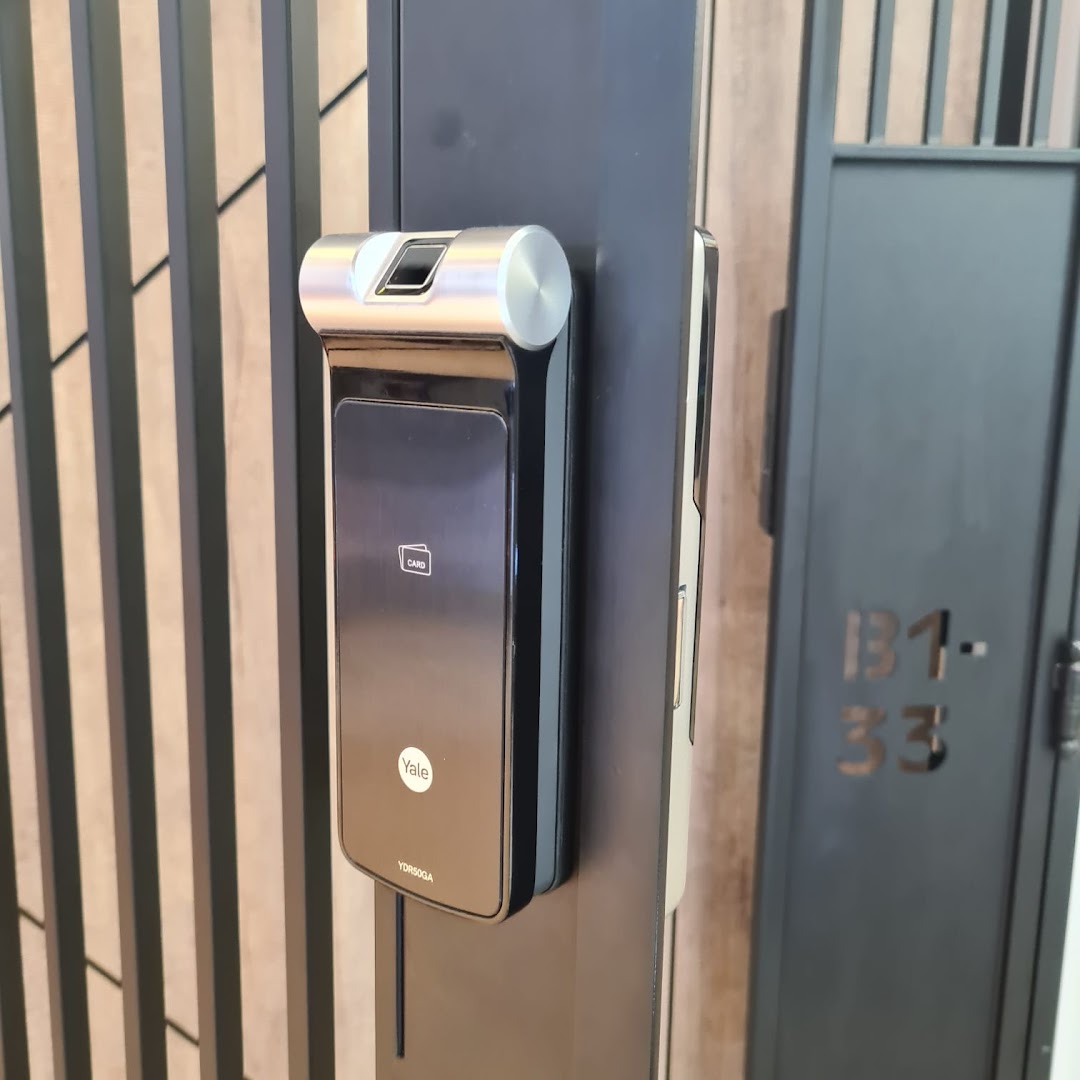 Close-up of a Yale digital lock with fingerprint and card reader.