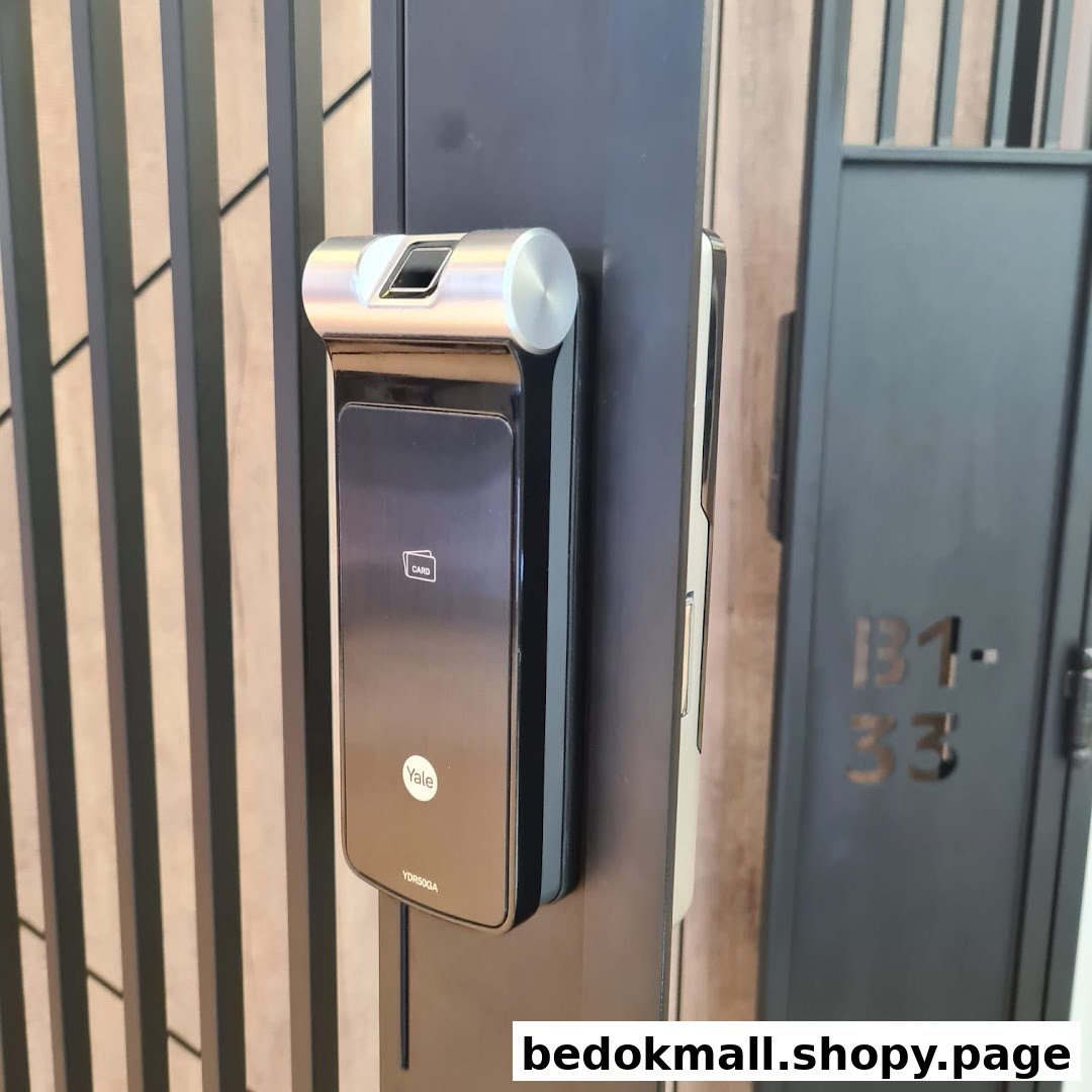 Close-up of a Yale digital lock with fingerprint and card reader.