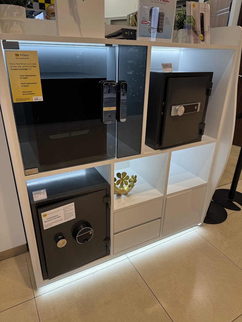 Display stand with Yale smart locks and safes in a retail store.