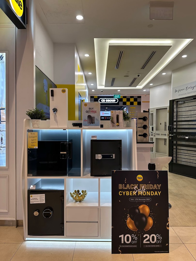 Interior shop display featuring safes, smart locks, and a Black Friday sale sign.