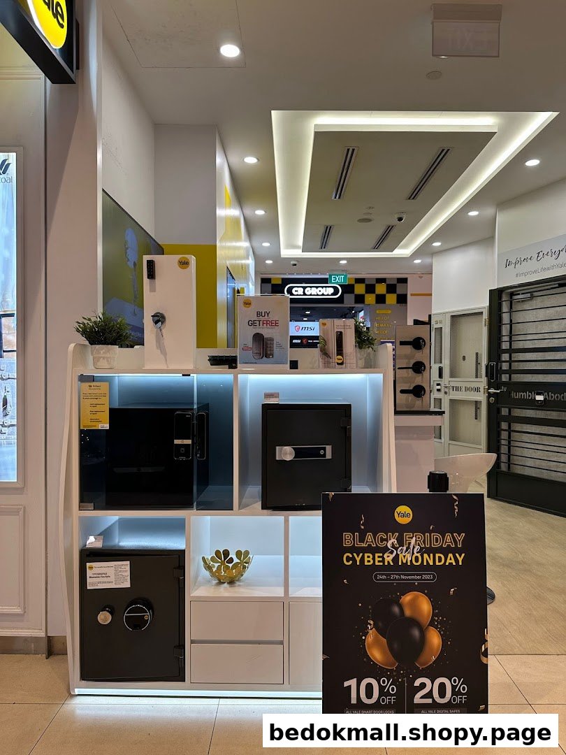 Interior shop display featuring safes, smart locks, and a Black Friday sale sign.