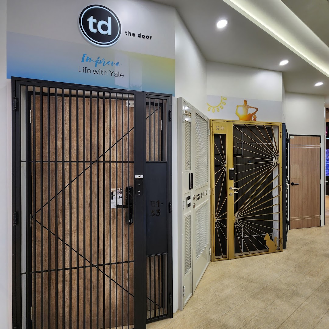 Interior view of a shop displaying various security doors and gates.