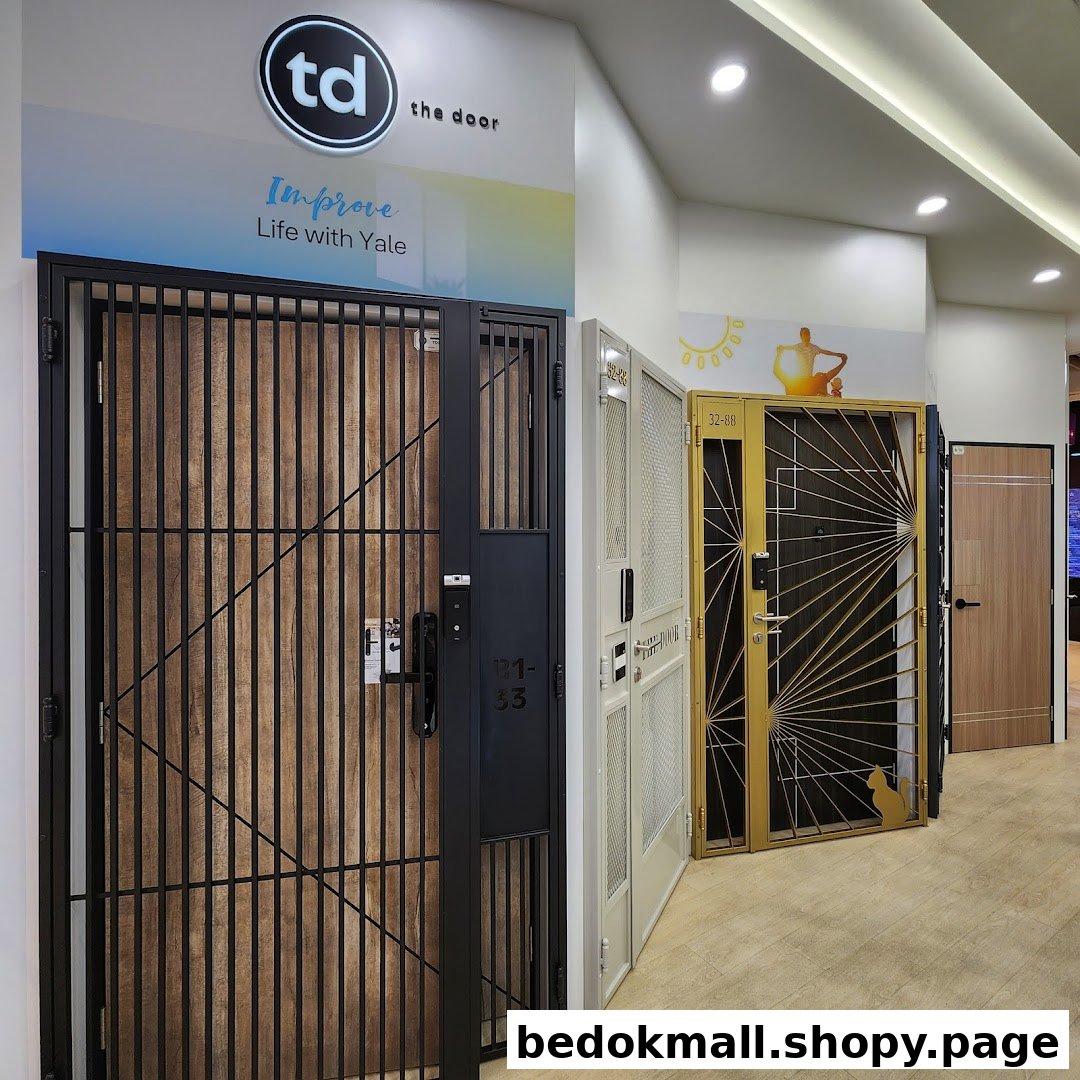 Interior view of a shop displaying various security doors and gates.