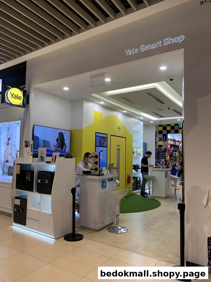 Interior view of Yale Smart Shop with staff and product displays.