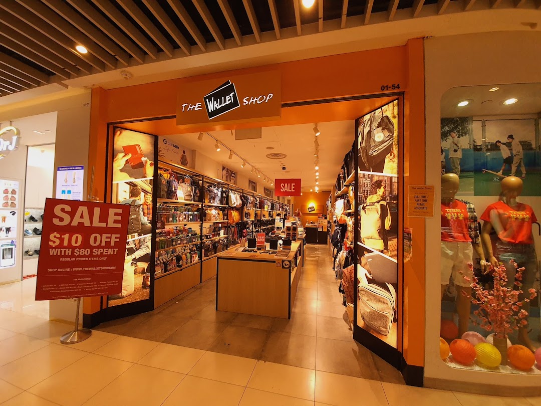 The Wallet Shop storefront with an open entrance and a sale sign.