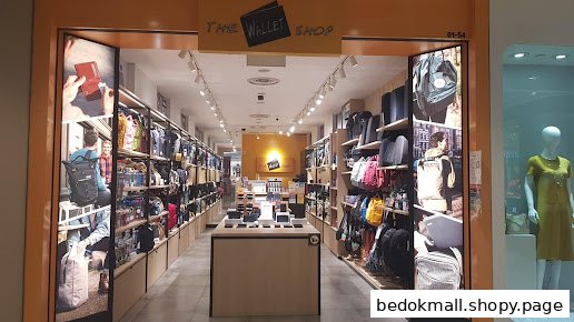 View of The Wallet Shop entrance, showcasing bags and wallets inside.