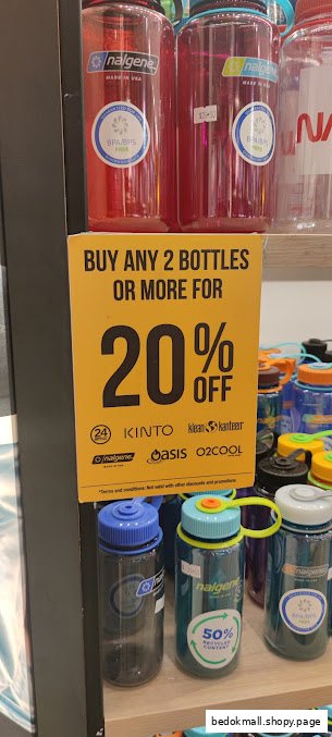 Water bottles displayed on a shelf with a 20% off promotional sign.